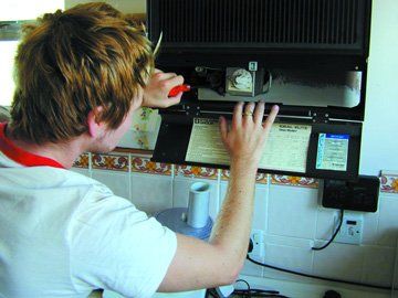 Electrical services - Palgrave, Norfolk -electrician working on a boiler - DAVID PEACHEY ELECTRICAL AND MECHANICAL Electrical services - Palgrave, Norfolk -electrician working on a boiler - DAVID PEACHEY ELECTRICAL AND MECHANICAL