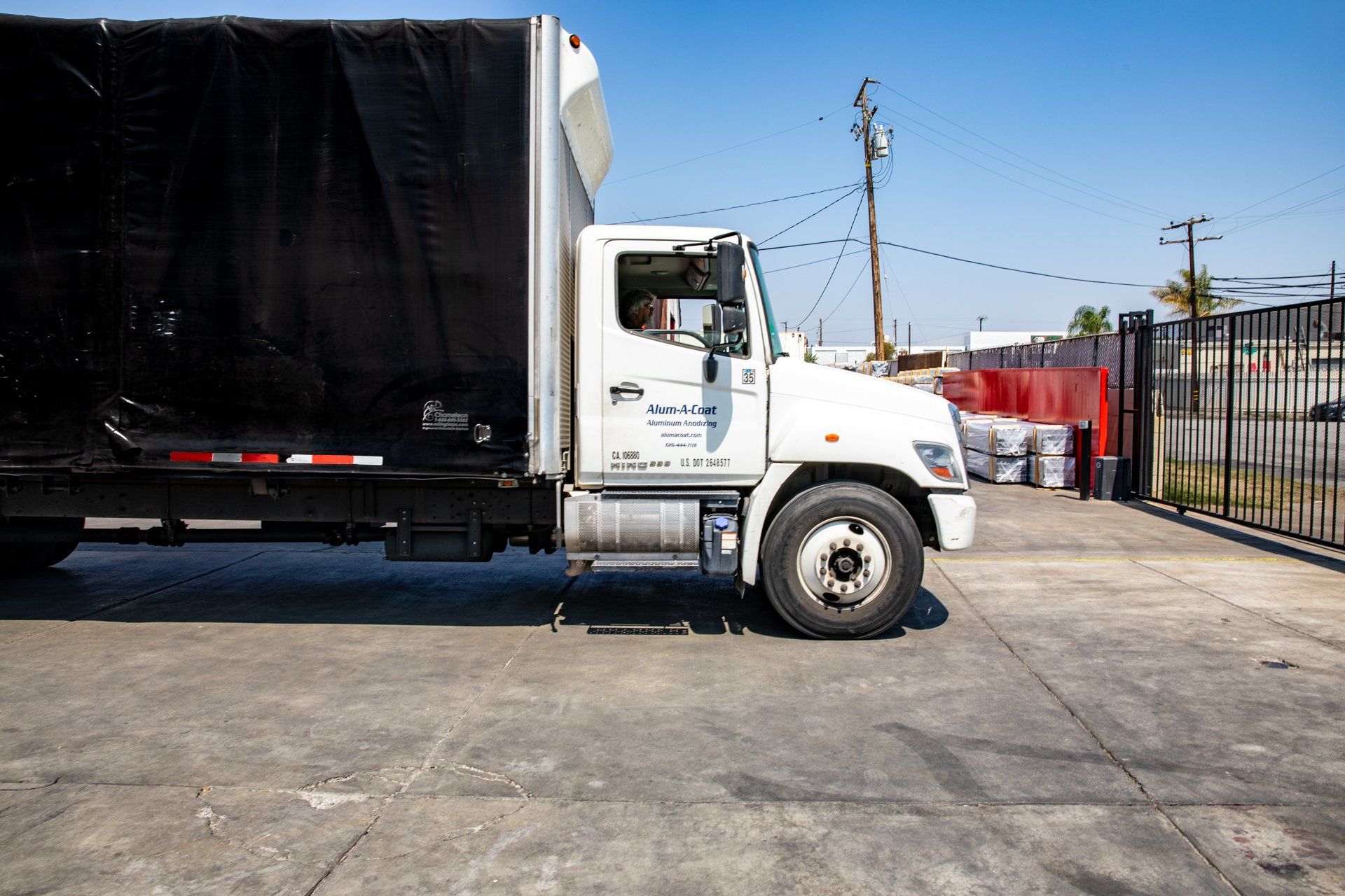 Truck driving off site to deliver metal