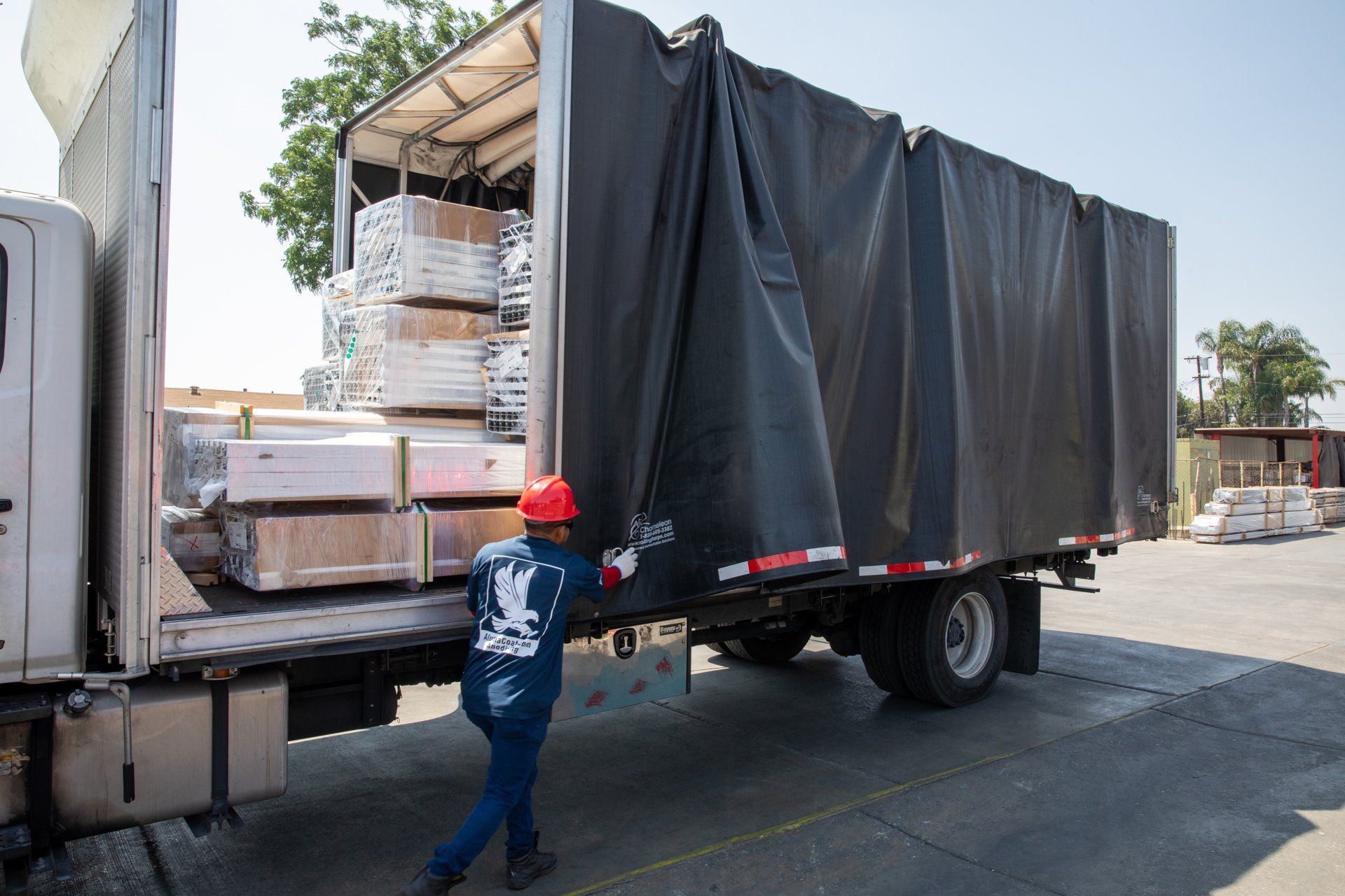 Man opening a large truck of anodized metals
