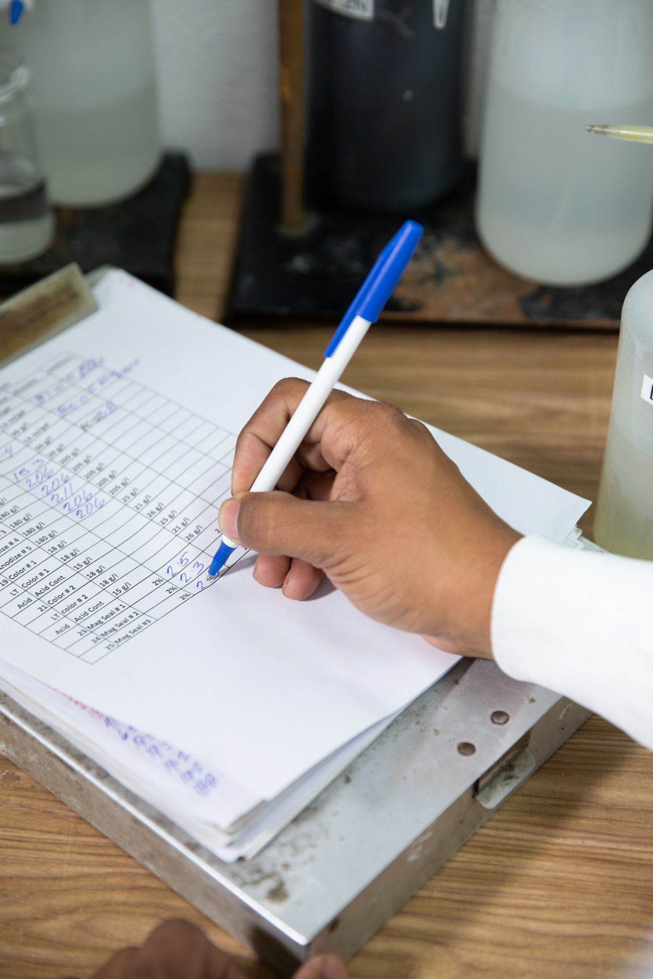 Notes being written down with pen on clipboard