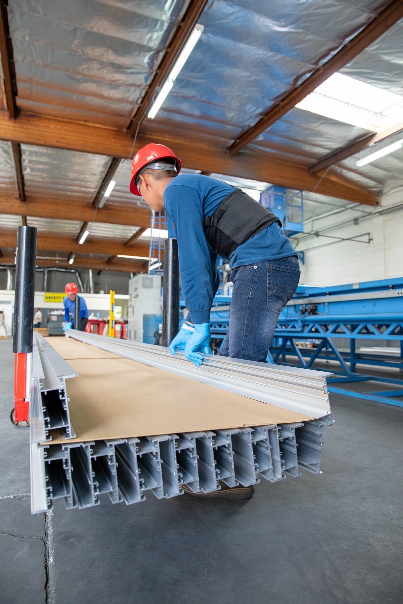 cardboard being stacked between pieces of metal