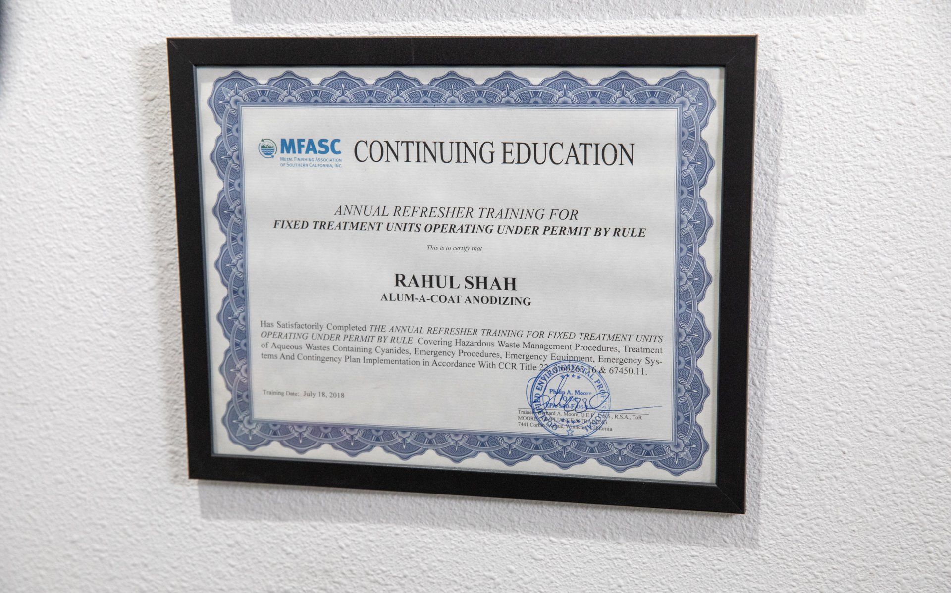 Certification award on wall