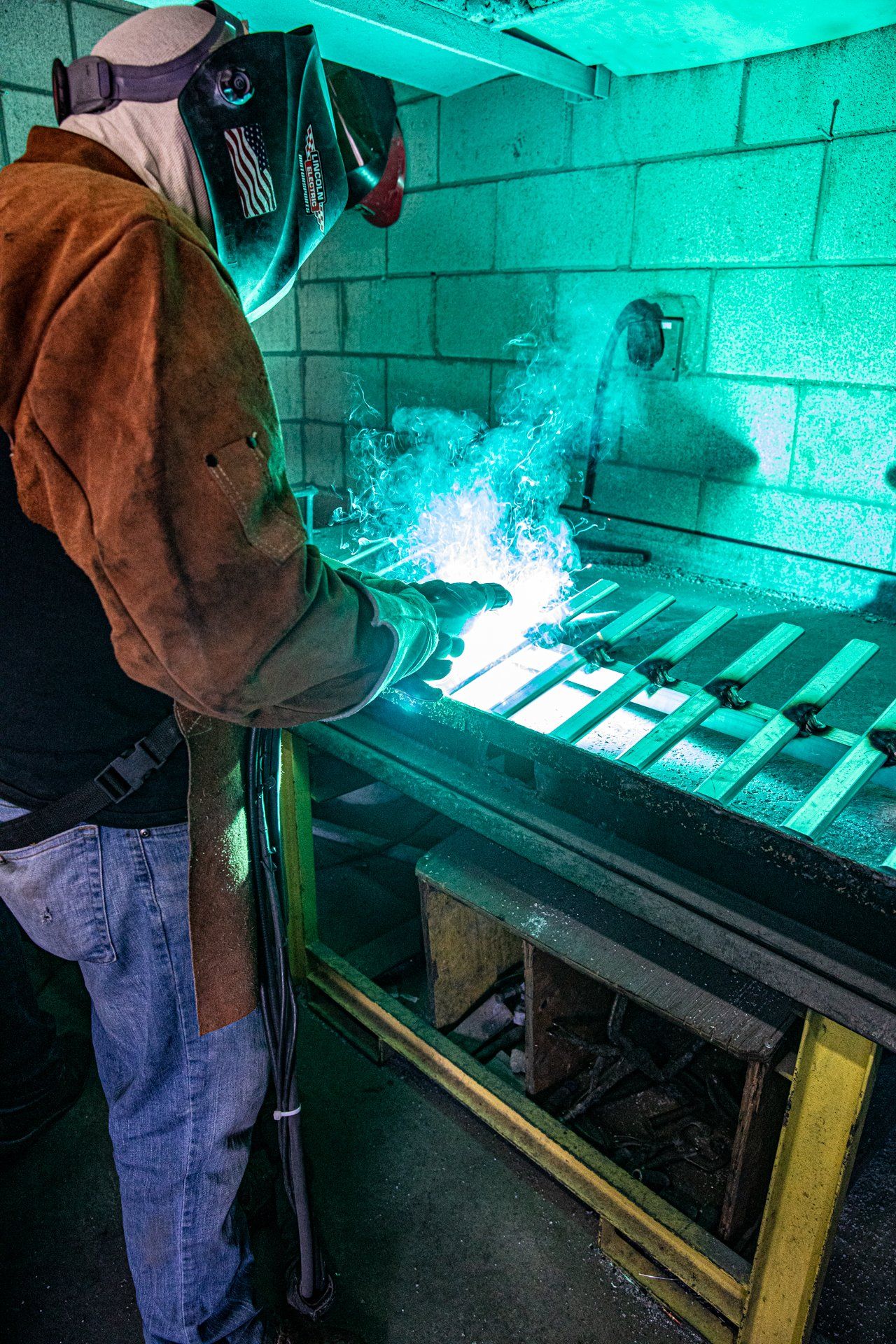 Man with welding tool and eye protection