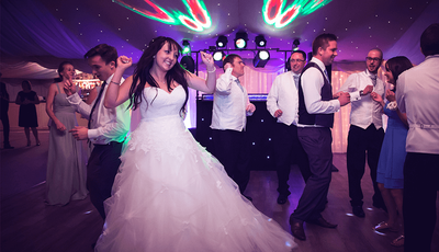 bride dancing surrounded by people