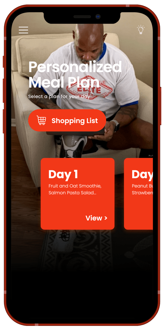 Flex Wheeler sitting in a chair looking at a tablet.
