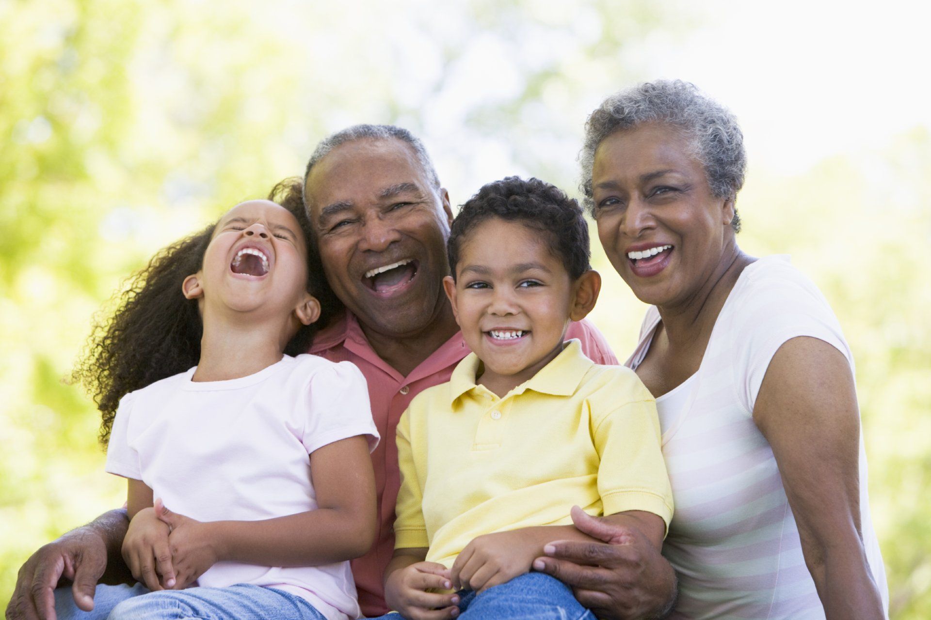 Grandparents laughing with grandchildren