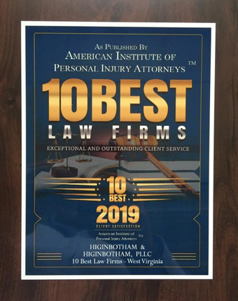 Blue and gold law firm award plaque reading “10 Best Law Firms” and “Best 2019.”