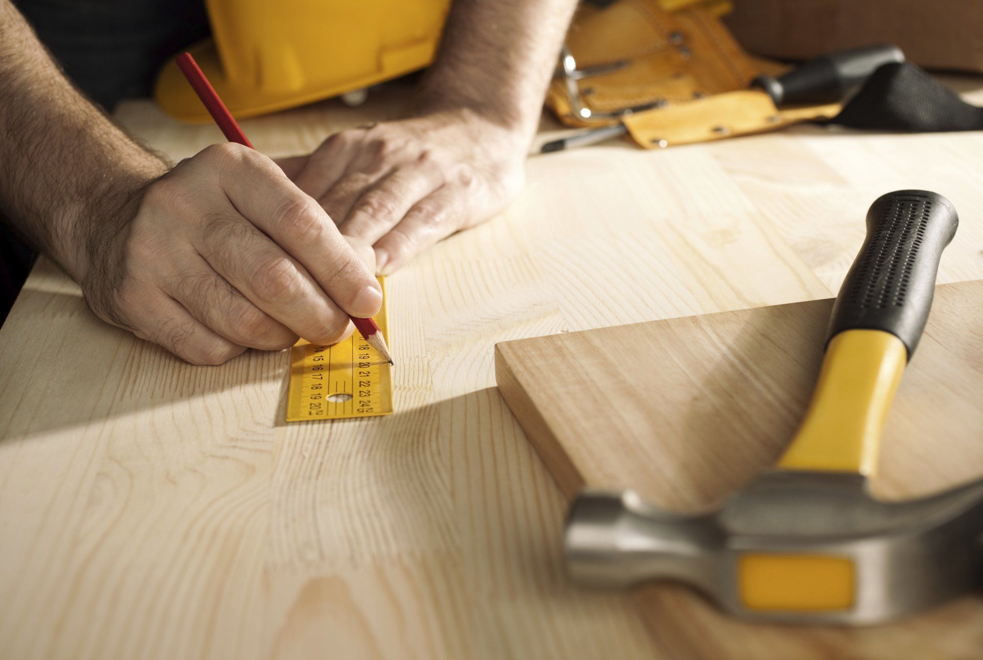 Dupage County — Carpenter Measuring The Wood in Crystal Lake, IL Dupage County — Carpenter Measuring The Wood in Crystal Lake, IL