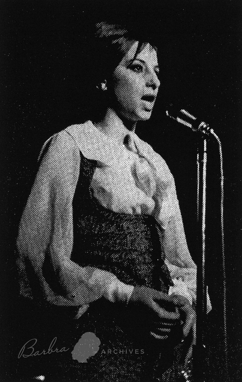 Streisand at the mic at the Blue Angel nightclub