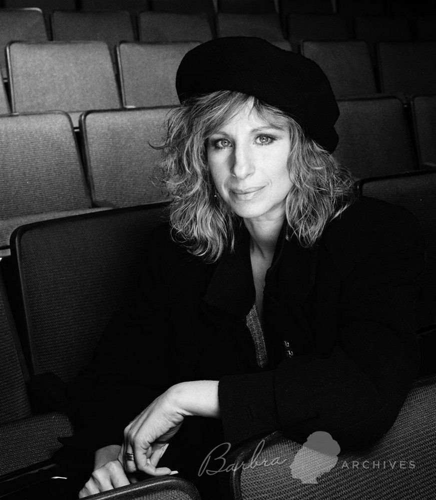 Black & white photo of Streisand in Broadway theater wearing beret by photographer Richard Corman