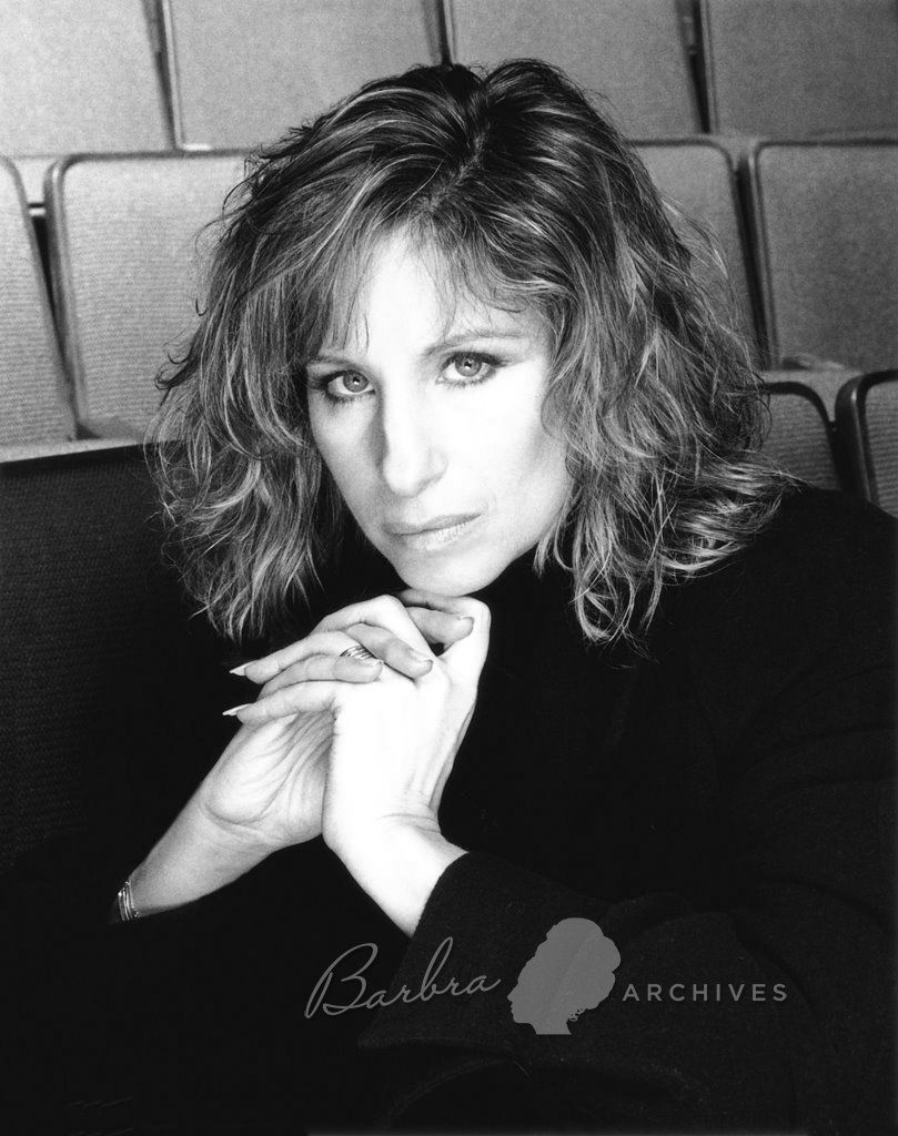 Black & white photo of Streisand in Broadway theater wearing beret by photographer Richard Corman