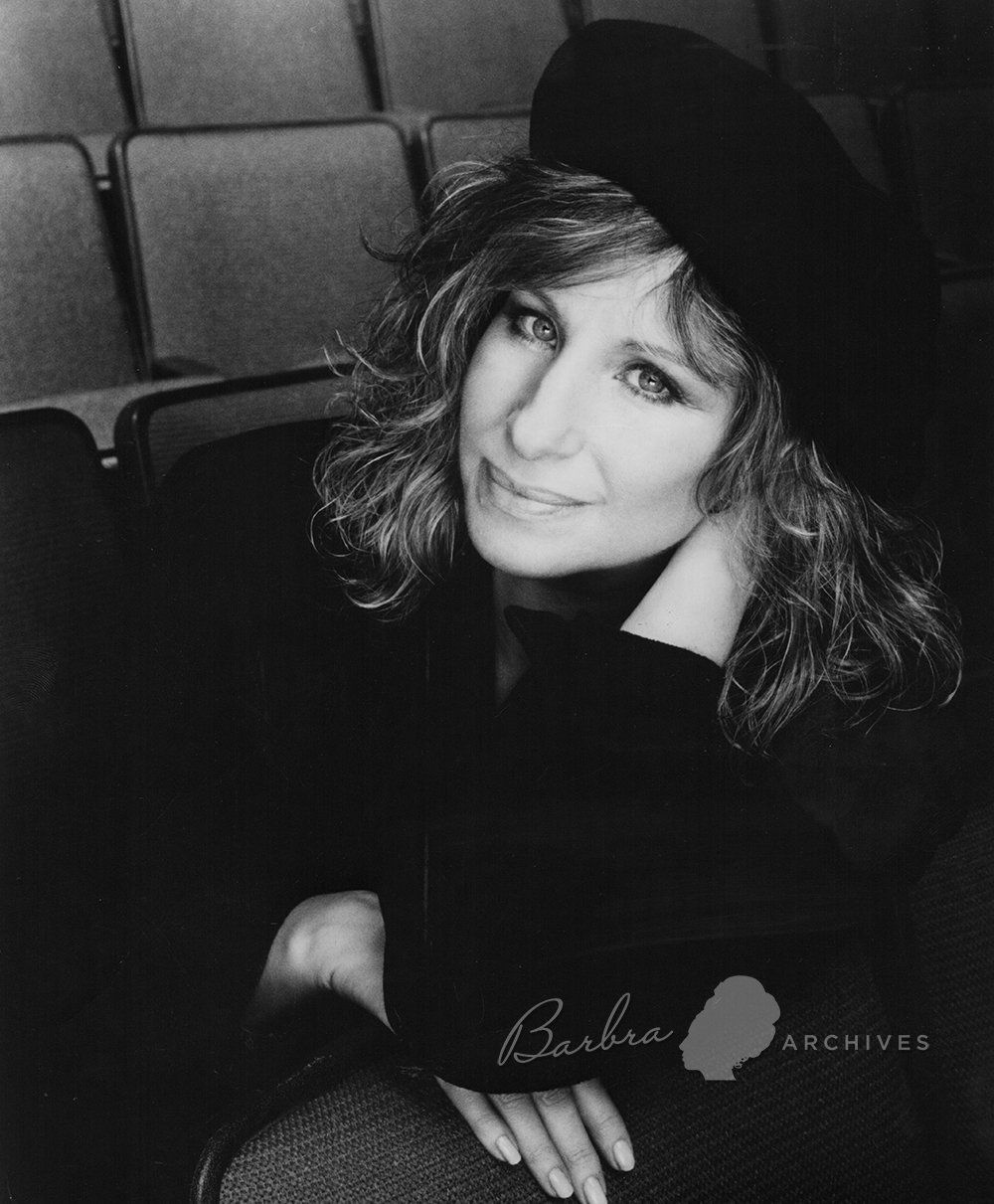 Black & white photo of Streisand in Broadway theater wearing beret by photographer Richard Corman