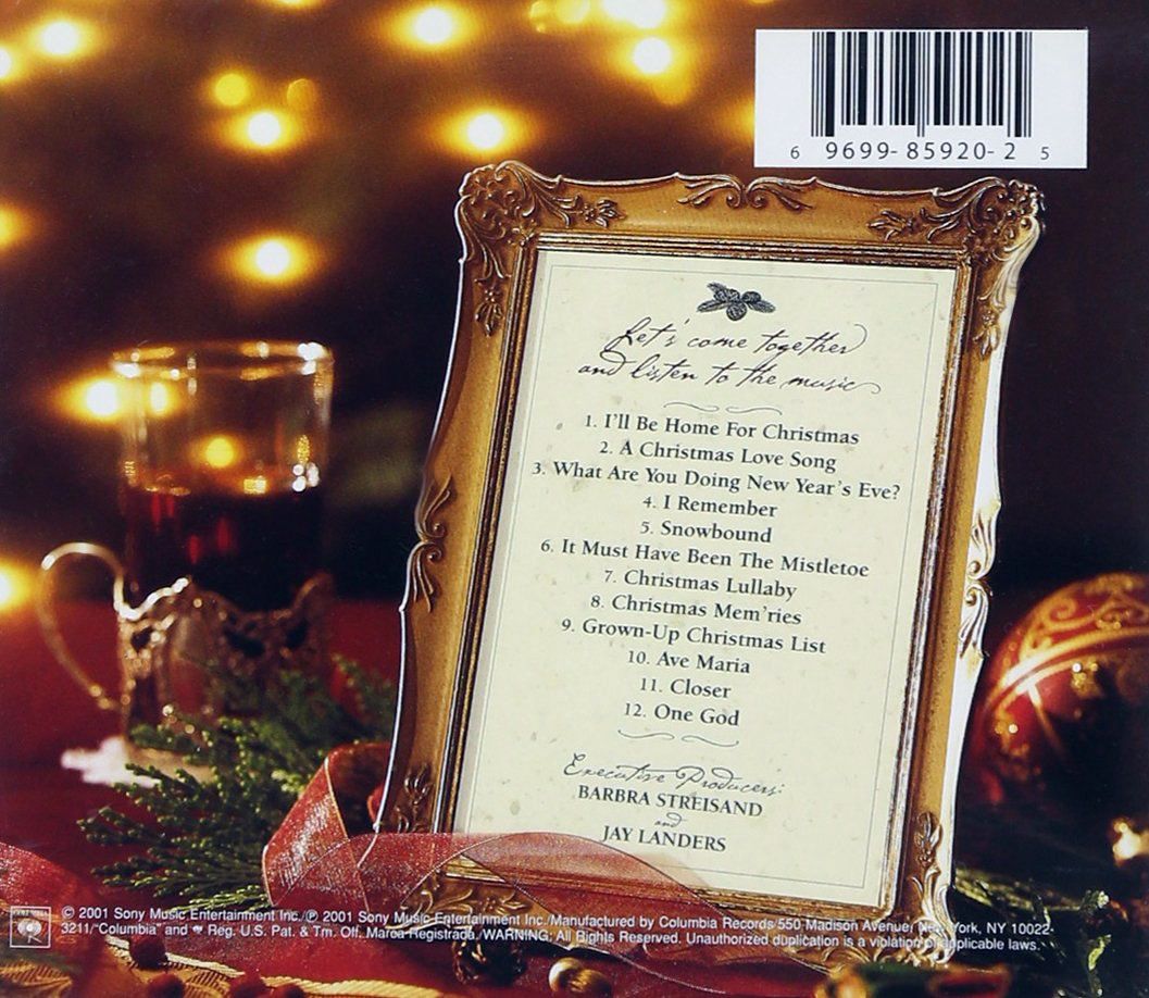 Framed menu card with gold trim on a festive table, lit by warm candlelight and holiday ornaments