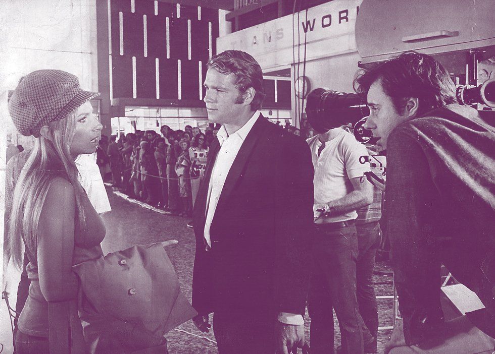 Streisand, O'Neal, and Bogdanovich filming at San Francisco airport.