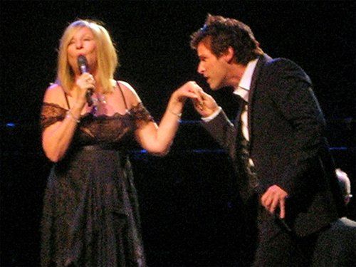 Hugh Panaro kisses Barbra's hand in Zurich.