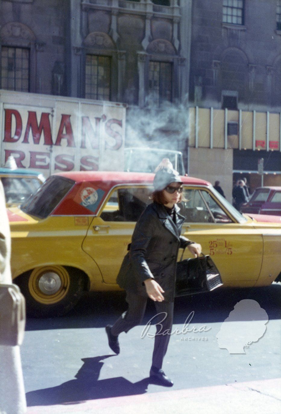 Streisand getting out of cab in front of the Winter Garden Theatre.