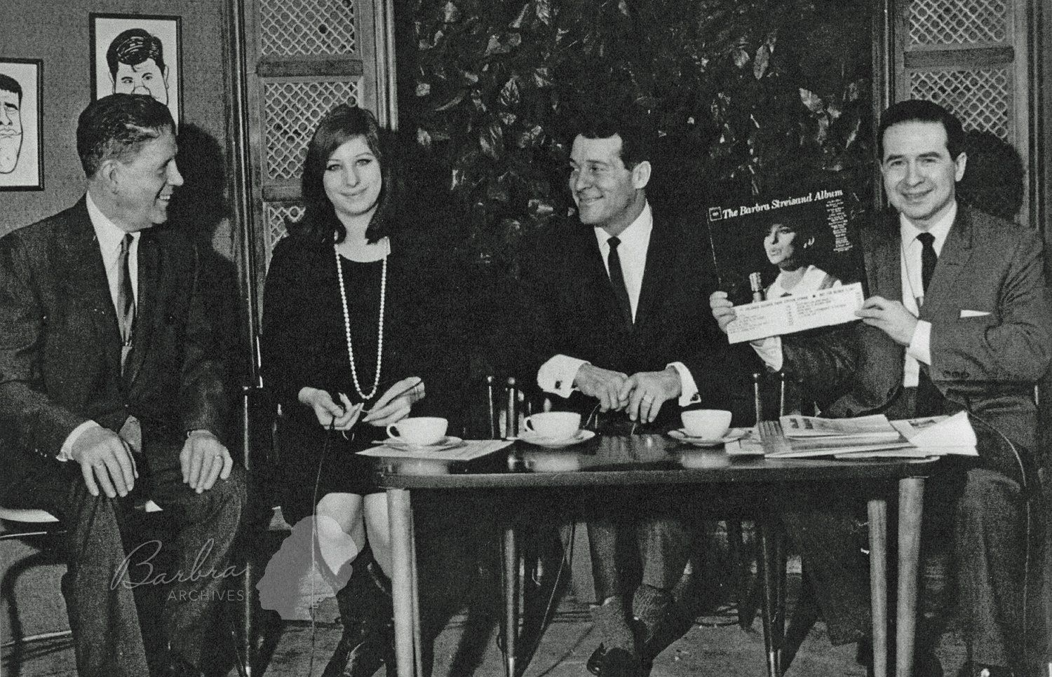 Streisand on Memory Lane. Joe Franklin holds up her first album.