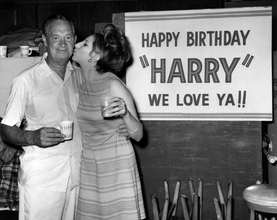 Barbra Streisand kissing Harry Stradling on his birthday, celebrated on set.