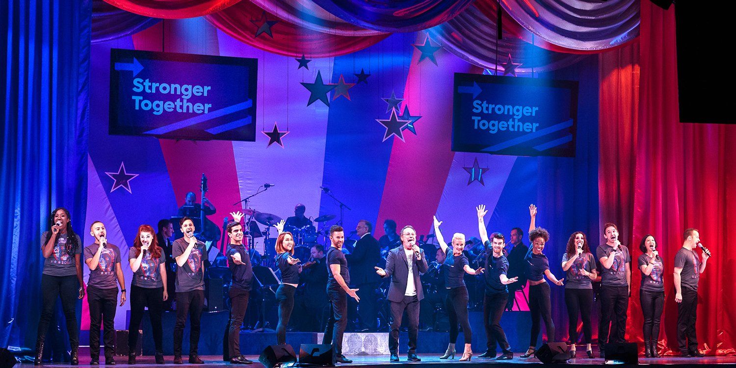 Billy Crystal on stage with Broadway singers.