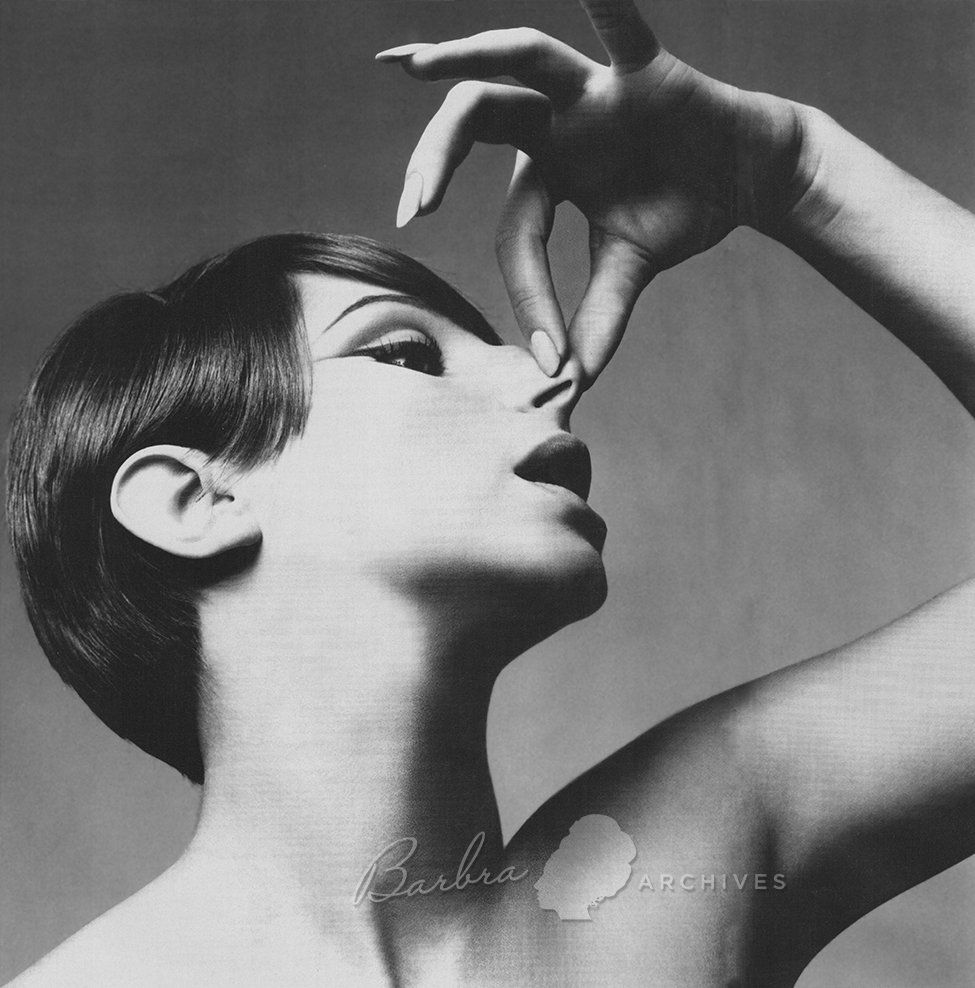 A humorous outtake from the Avedon photo sessions that shows Barbra holding her famous nose.