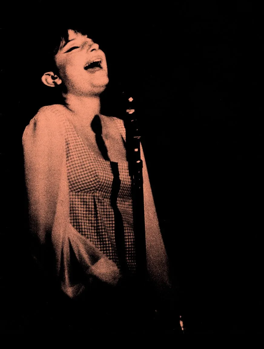 Streisand singing into microphone at Mister Kelly's nightclub, 1963.
