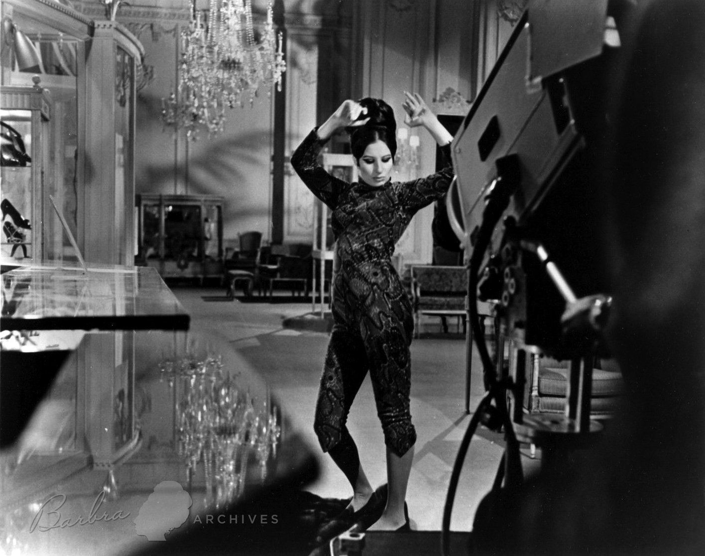 Streisand stomps on a mink coat as the video camera records the musical number.
