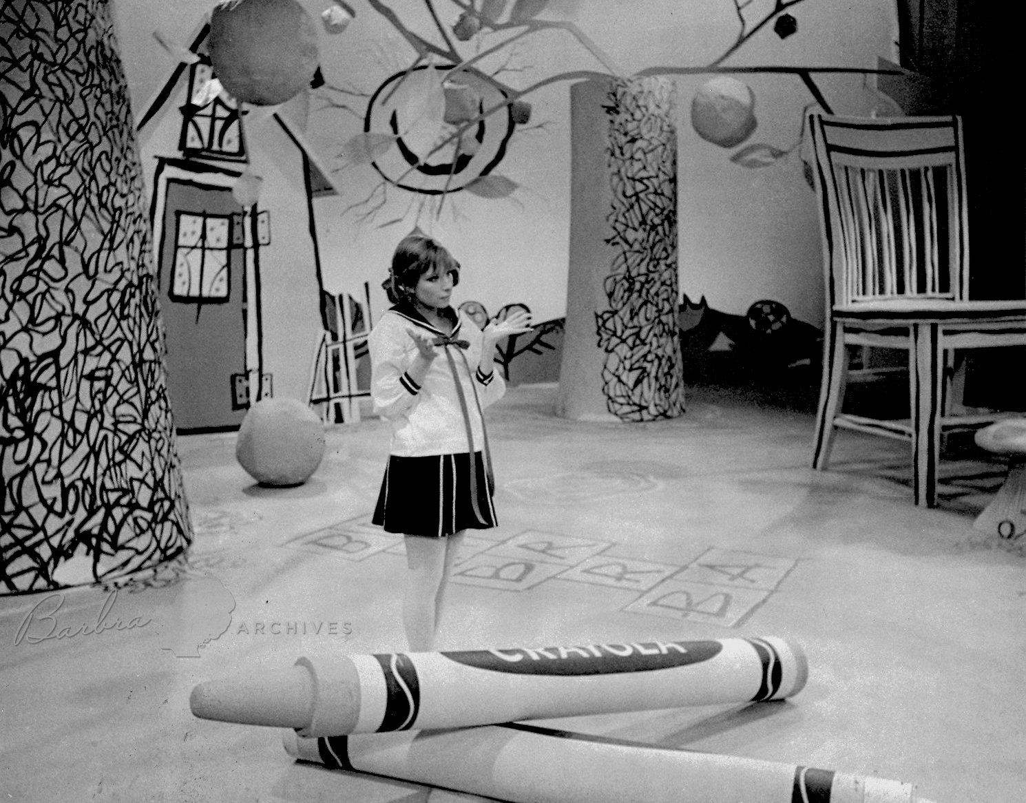 Streisand dressed as little girl.