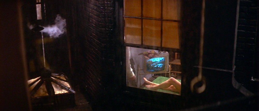 Scene from the movie showing Doris in bed as spied through the open window.