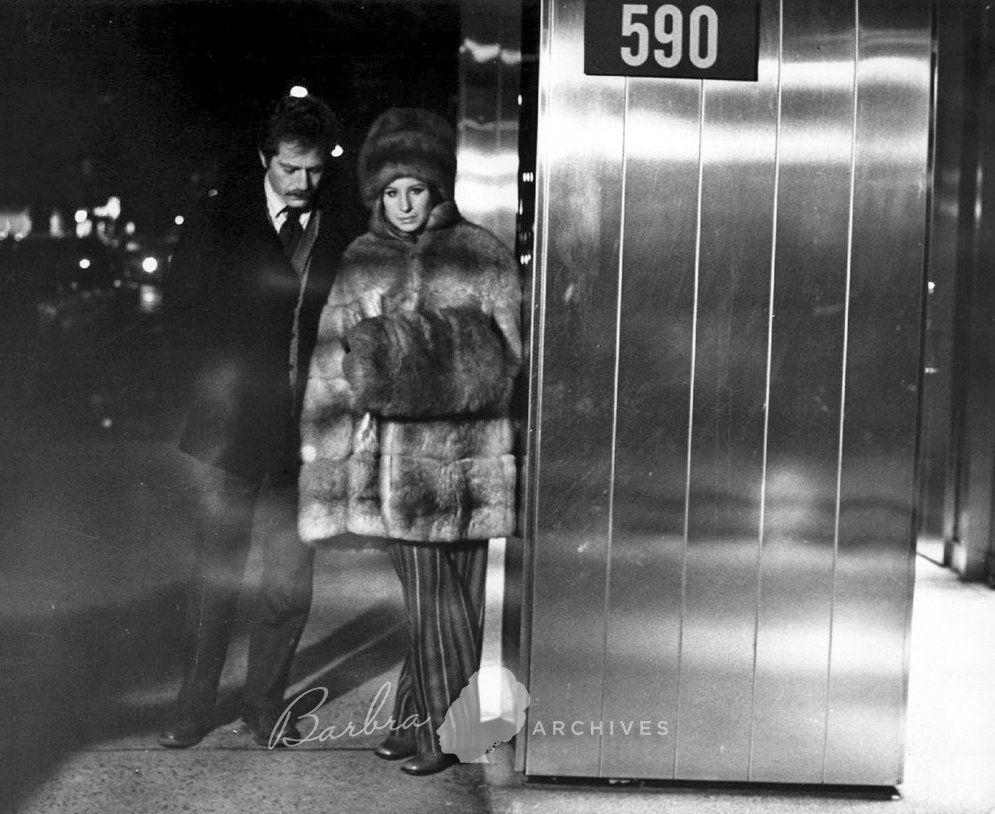 George Segal and Barbra on the New York City set of the movie, with Barbra wearing heavy furs and a hand muff -- must have been cold!