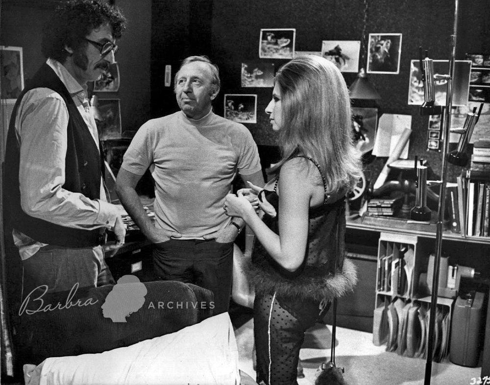 Director Herb Ross, producer Ray Stark, and Barbra all discuss a scene they are filming.