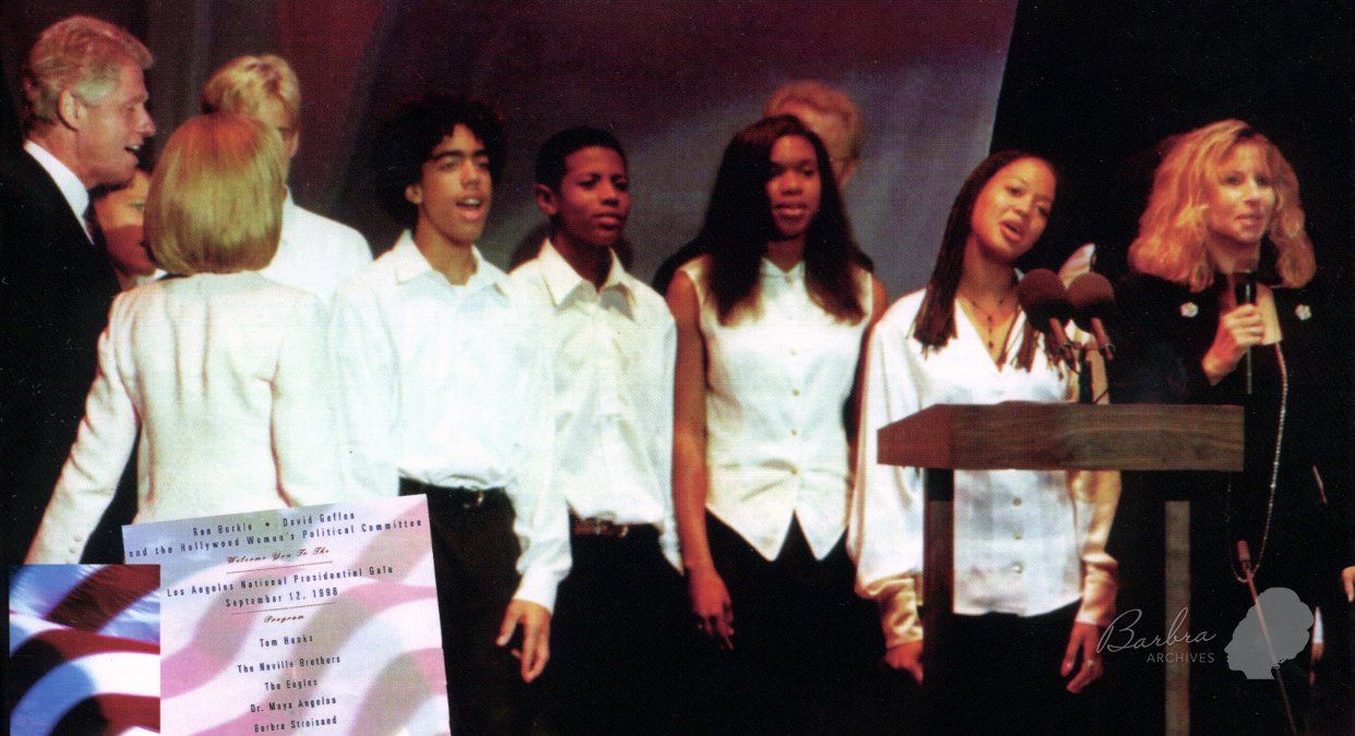 The Clintons join Barbra Streisand and a choir on stage to sing 
