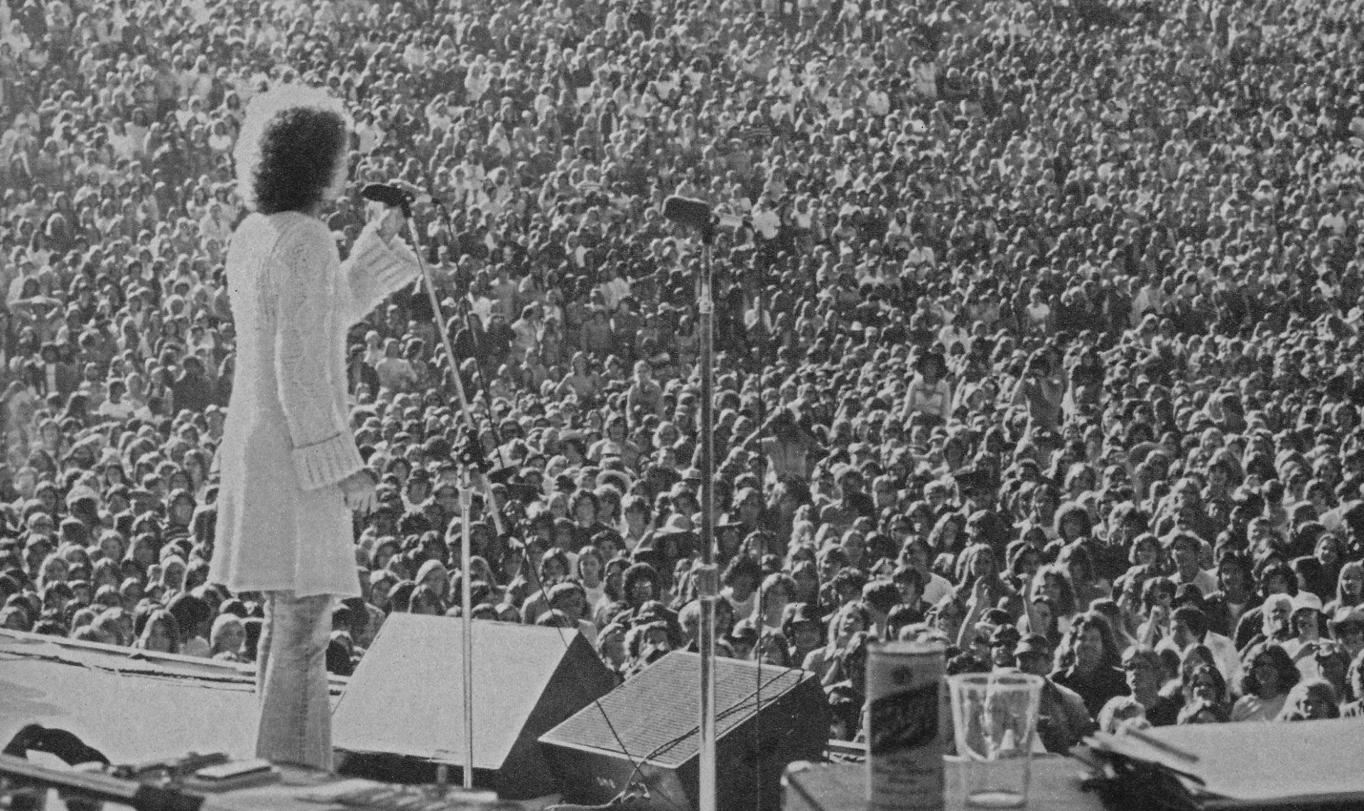Streisand singing on stage at Sun Devil Stadium.