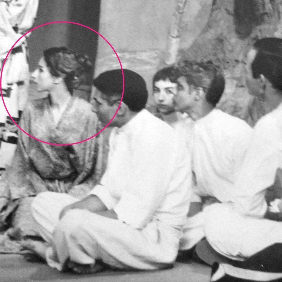 Closeup of Streisand in ensemble playing child.