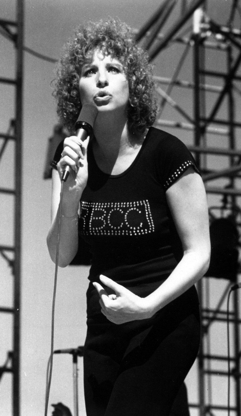 Streisand singing in black BBCC t-shirt.