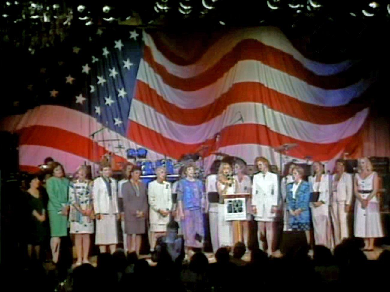 Wide shot of celebrities on stage for Women for Change event.