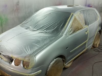 Close up on the shiny bodywork of a black car
