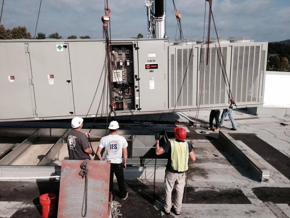 Commercial Electrician — Hands of Electrician with Screwdriver Tighten Up Switching Electric Actuator Equipment in Cleymont, DE Commercial Electrician — Hands of Electrician with Screwdriver Tighten Up Switching Electric Actuator Equipment in Cleymont, DE