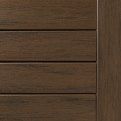 Close-up of a dark brown wooden drawer front with horizontal panels and visible grain.