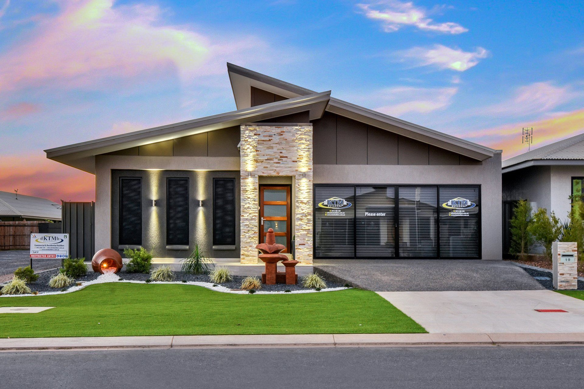A large house with a lot of windows is for sale.