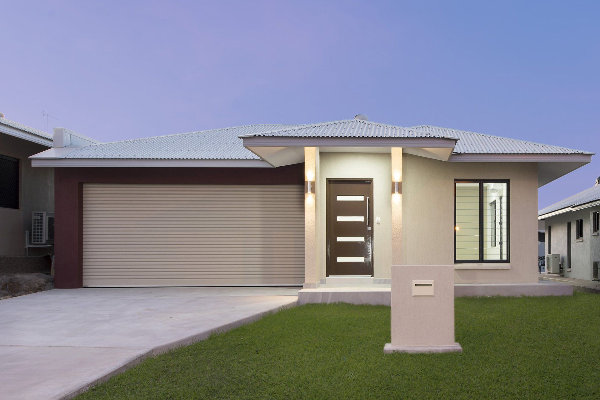 The front of a house with a large garage door