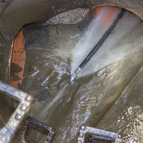 A close-up of a pipe with water. A close-up of a pipe with water.