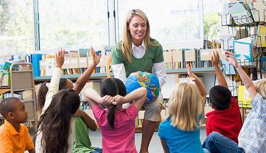 Teacher and student in class - Day Care Center in Northglenn, CO Teacher and student in class - Day Care Center in Northglenn, CO