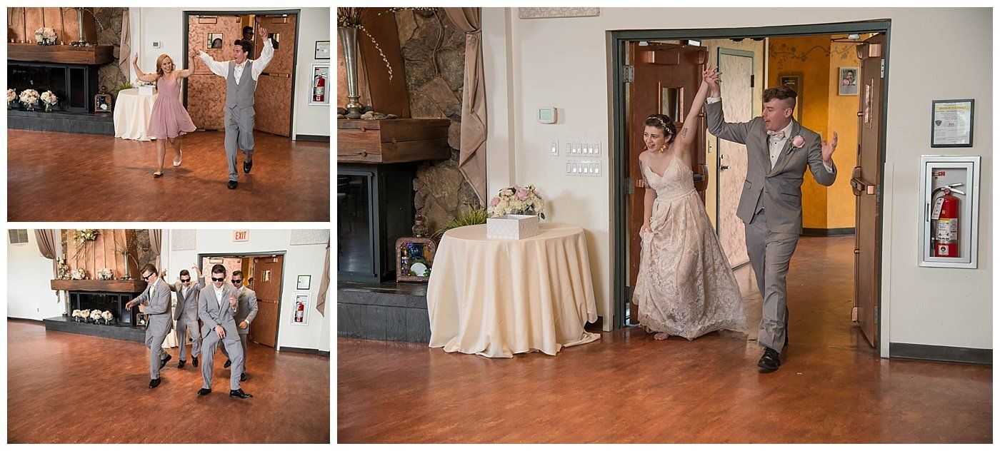 Bride and groom enter a reception hall, dancing and smiling in a rustic room with a wooden floor