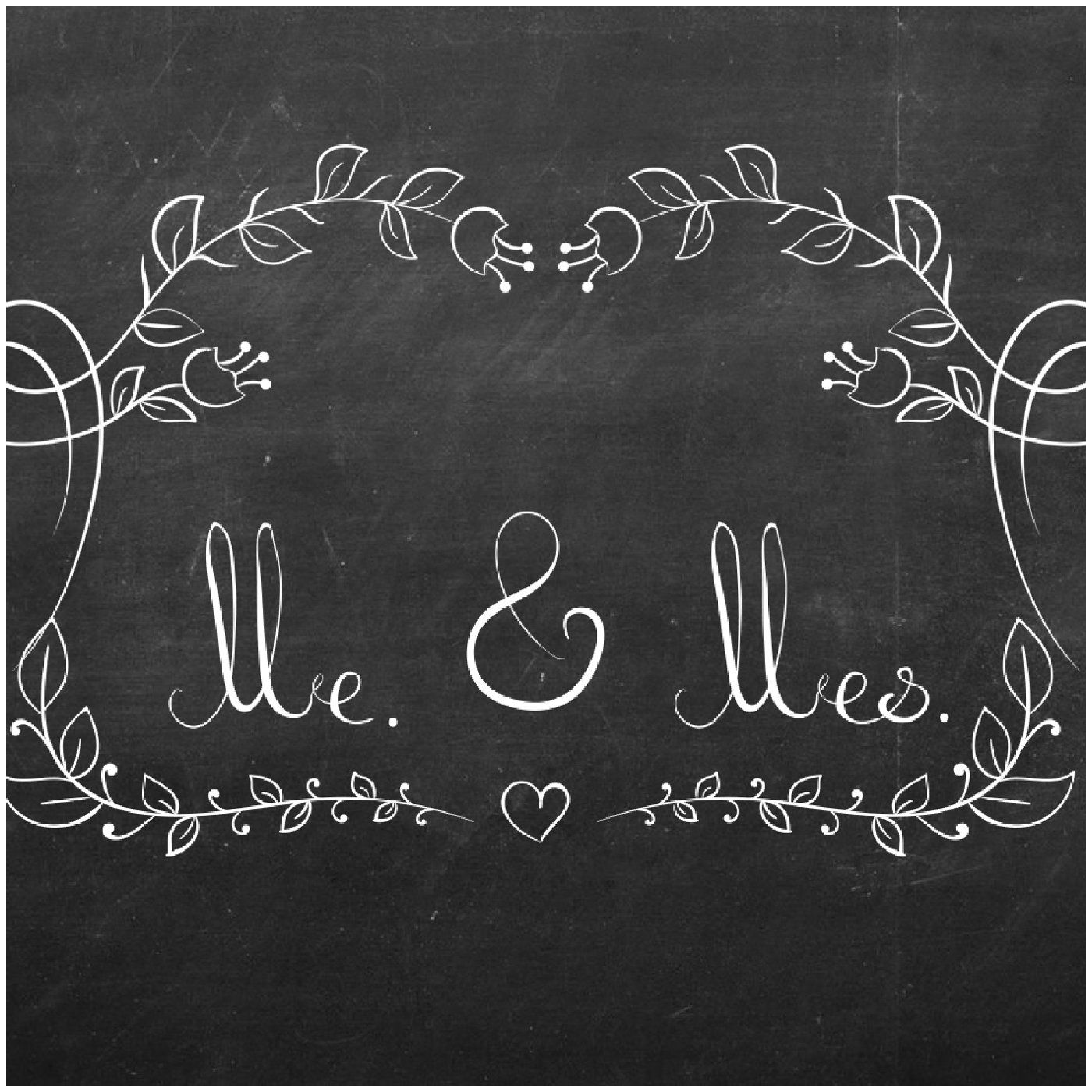 Chalkboard-style “Mr. & Mrs.” wedding sign with white floral vines and a small heart on black background