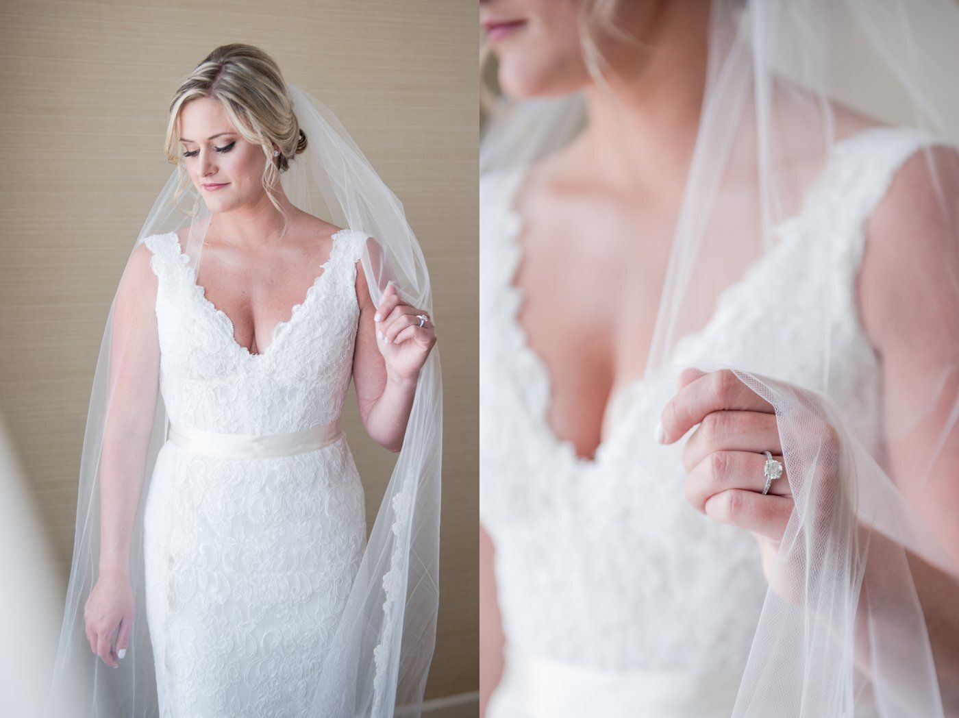 Bride in white lace gown and veil adjusting her dress in a soft-lit room