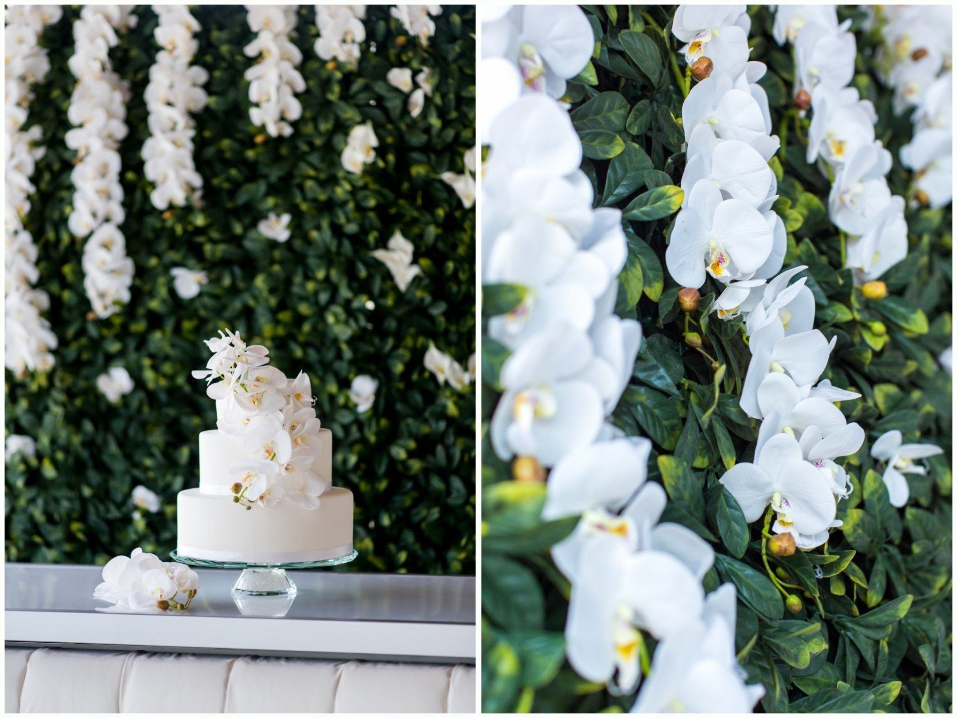 Two-tier white cake on a table before a white orchid flower wall backdrop