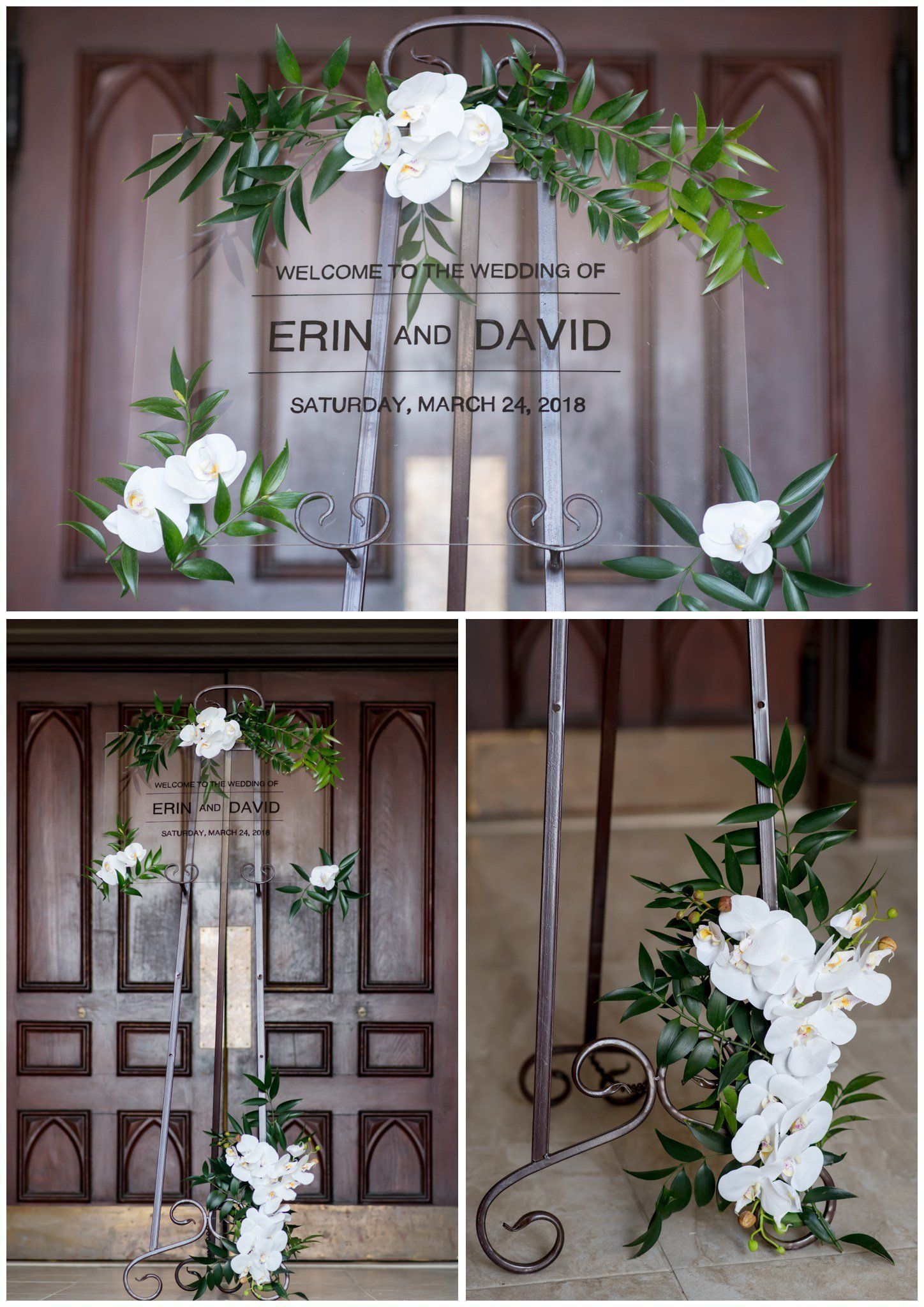 White floral wedding arch and entrance decor with “Erin + David” sign on wooden doors
