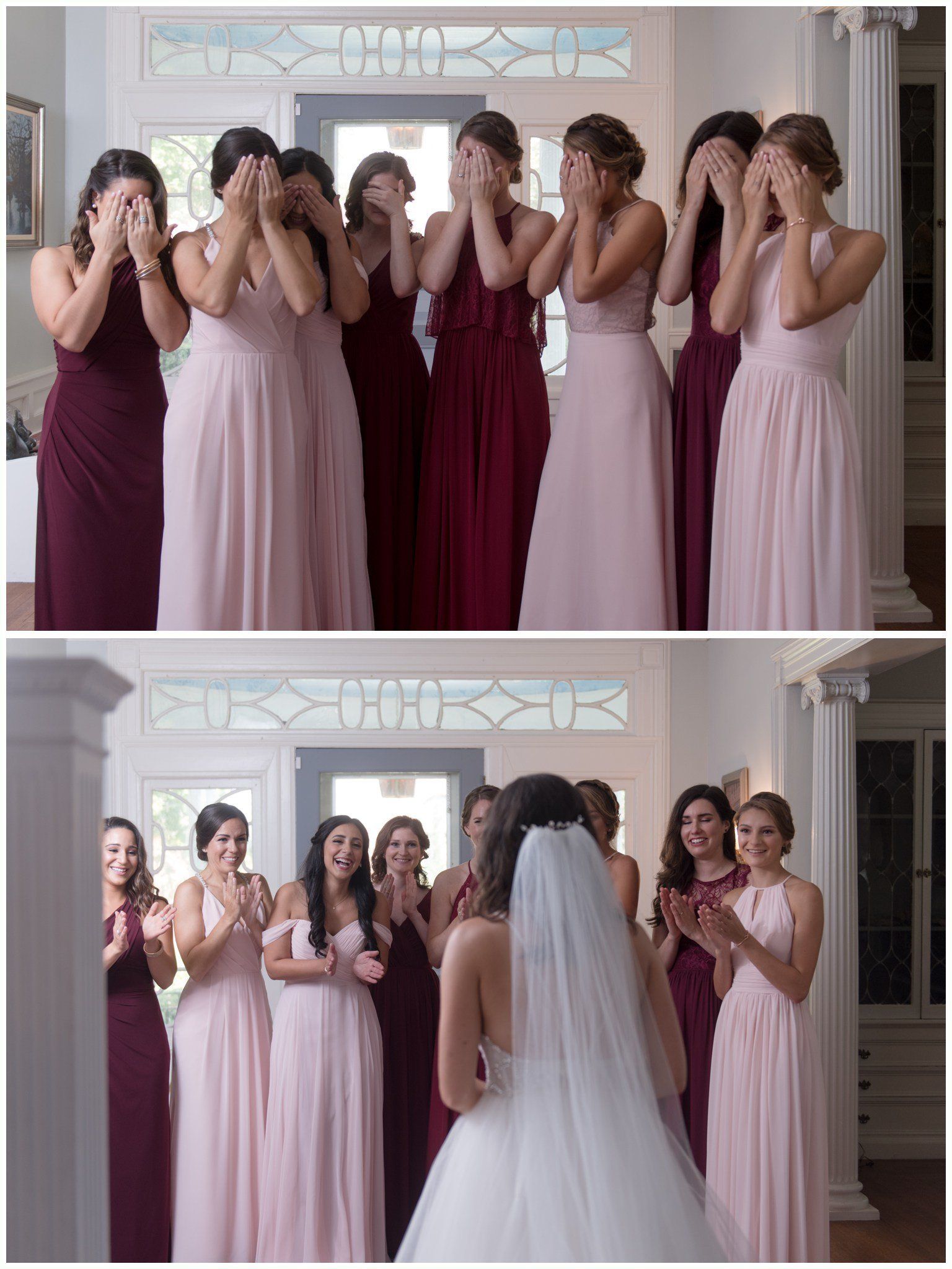 Bride in white dress faces bridesmaids in pink and burgundy dresses, all smiling indoors at a wedding.
