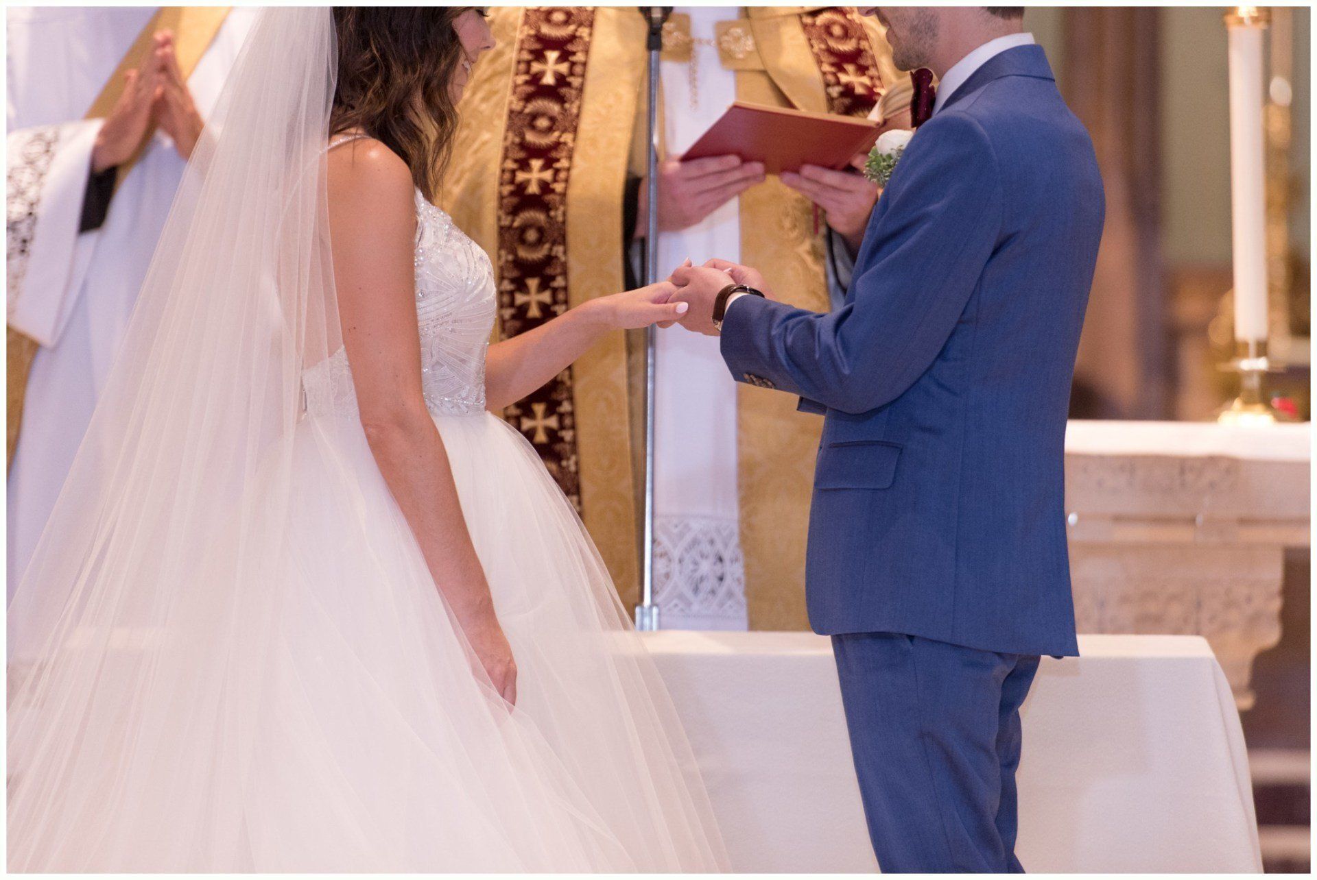 Bride and groom exchanging rings during a wedding ceremony at the altar
