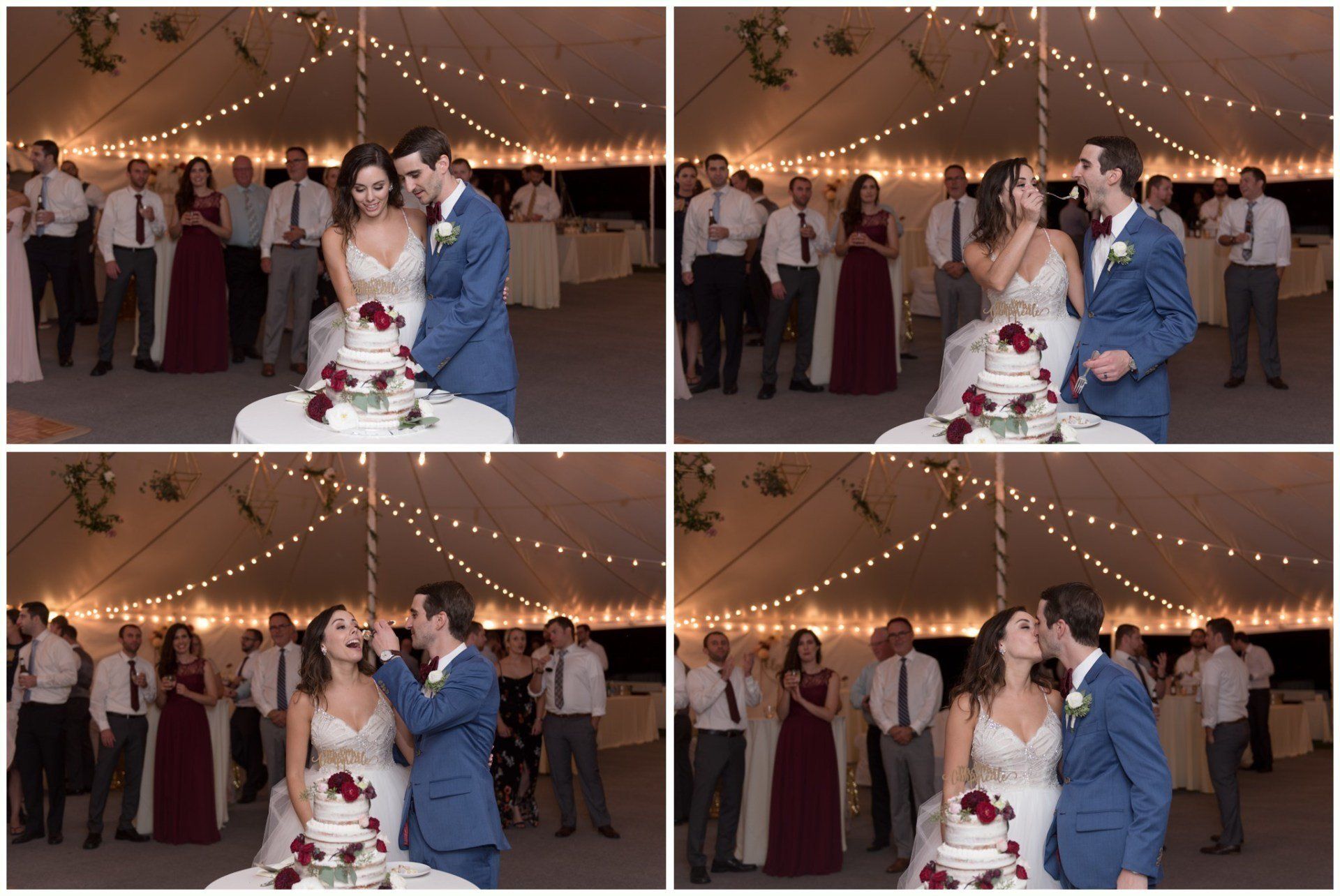 Wedding couple kissing beside a white cake under string lights in a reception tent